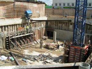 Pouring concrete into one sided wall formwork.