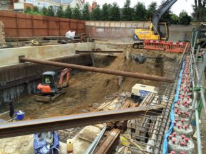 Excavation, within a secant piled coffer dam.