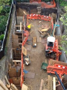 Deep underpinning to garden walls.